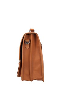 Tan leather bag with a rectangular shape, featuring a side view, sturdy stitching, and a metal ring detail on a strap.