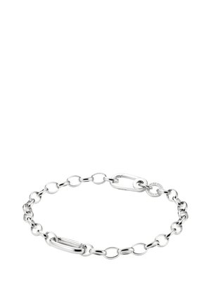 Silver chain bracelet with alternating oval and circular links, featuring a small round tag near the clasp on a white background.