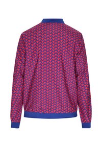 Lichte jas met een levendige blauwe basis en een herhalend patroon van rode hondsilhouetten. Ribgebreide kraag en manchetten, op maat gemaakte pasvorm.