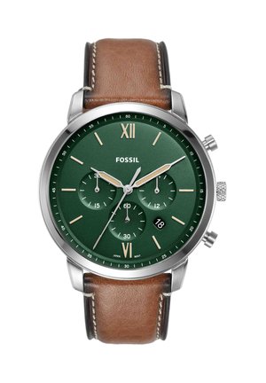 Round silver Fossil watch with green dial, brown leather strap, three subdials, date display, and gold-tone Roman numerals at 12 and 6.