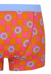 Boxers pour garçons colorés avec un motif en damier rose et orange, ornés de marguerites blanches et de visages souriants. Ceinture souple et élastique.