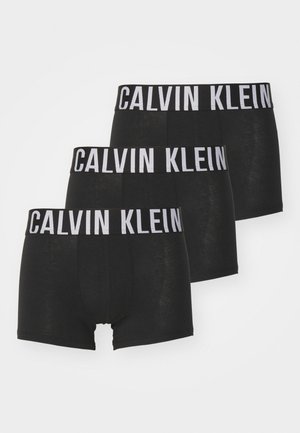 Shorts en coton noir avec une large ceinture élastique portant le logo "CALVIN KLEIN" en blanc. Ensemble de trois paires. Texture douce, forme ajustée.