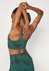 ICANIWILL DEFINE SEAMLESS TIE DYE BRA - Medium support sports bra - hunter green