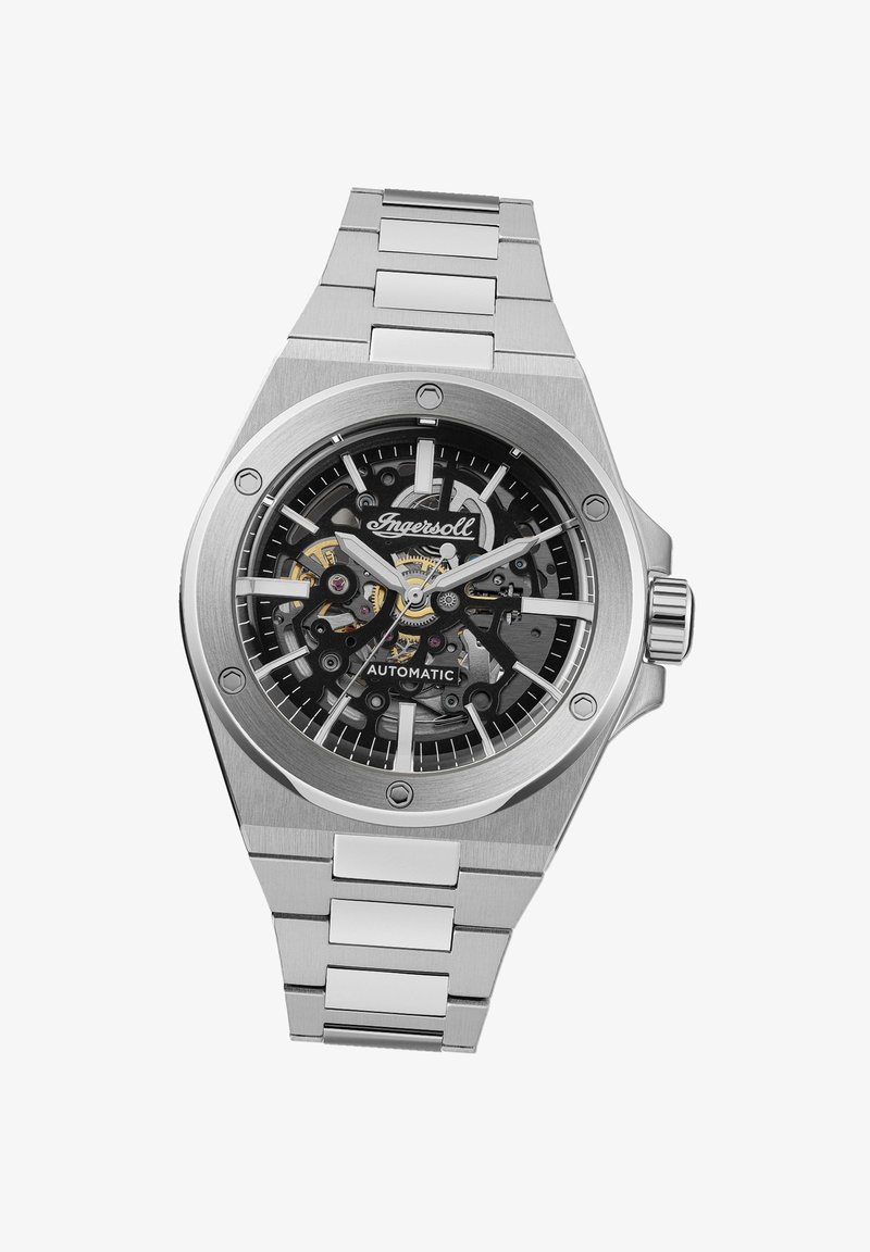 RVS automatische horloge met een zwart skeletuur, zilverkleurige accenten en een schakelband; beschikt over gedurfde uurmarkeringen en wijzers.