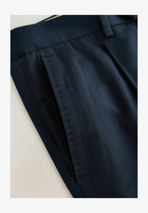 Navy blue fabric trousers with a smooth texture, featuring a straight fit, tidy stitching, and a flat front pocket design.
