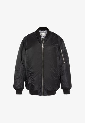 Zwarte bomberjack van glanzend nylon. Voorzien van een rits aan de voorkant, ribgebreide boorden, zijzakken en een extra ritszak op de arm.