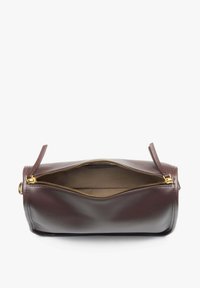 Brown leather handbag with a cylindrical shape, featuring a gold zipper and two short handles on each side. Interior is a lighter tan color.