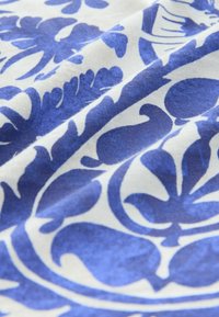 Unselected, blue tile print