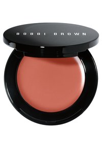 Bobbi Brown cream rouge i en rund, svart kompakt med en blank finish; har en mjuk, korallpeach nyans inuti.