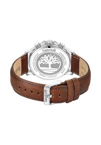 Orologio con bracciale in pelle marrone e cassa in acciaio inossidabile, con quadrante rotondo e logo Timberland. Resistente all'acqua con un emblema decorativo a forma di albero.