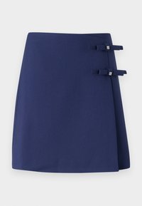 Navy blue wrap skirt with a textured finish, featuring two small fabric bows as accents on the side. Simple and structured design.