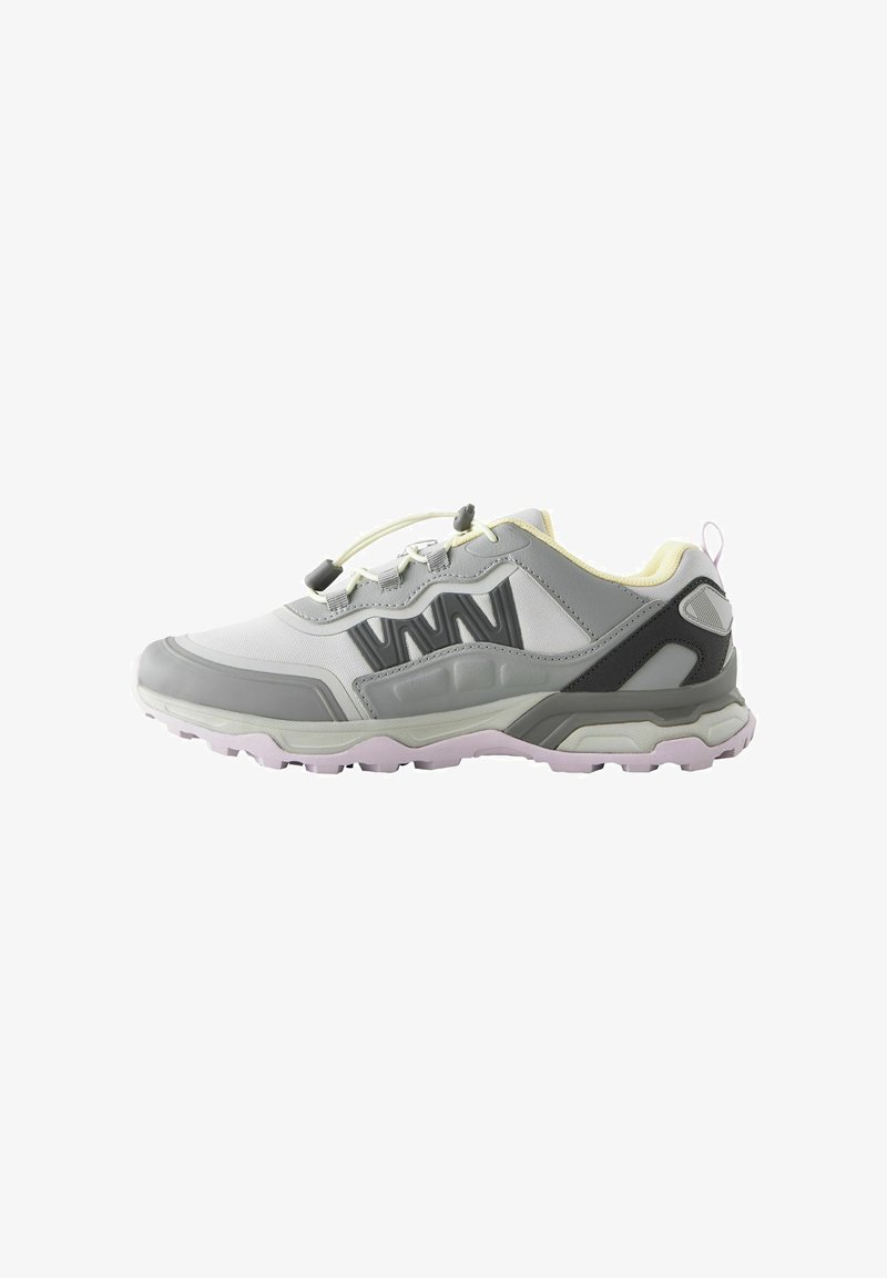 Gray and white athletic shoe with a textured upper, rubber sole, and elastic laces. Features yellow accents and a reinforced heel.