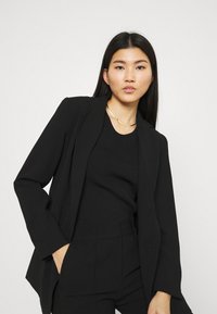 Stylein BEN - Tygbyxor - black