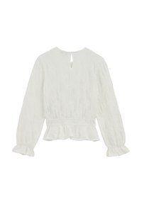 Blouse blanche à manches longues avec une finition texturée, ourlet et poignets à volants. Détail dos avec ouverture en trou de serrure et taille élastique froncée.
