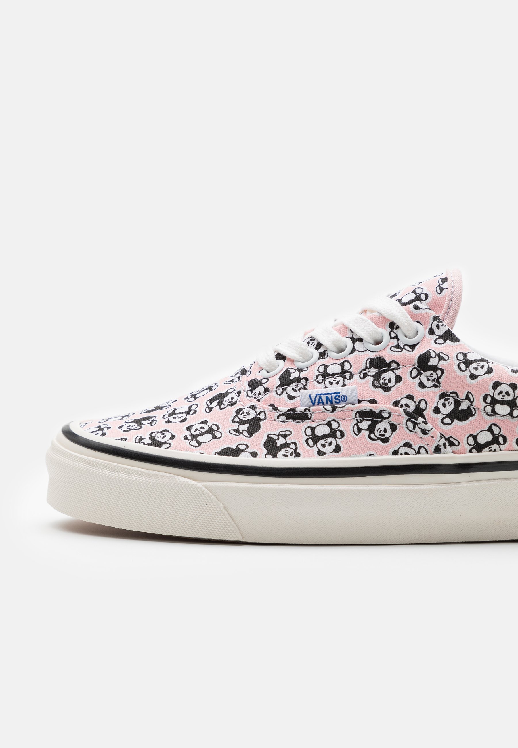 light pink and black vans