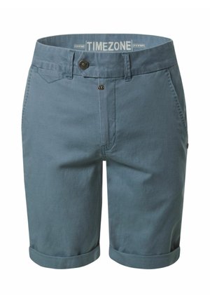 Blaue Baumwollshorts mit aufgekrempelten Säumen, Gürtelschlaufen, vorderem Knopf- und Reißverschluss sowie seitlichen Taschen, innen im Bund mit "TIMEZONE" gebrandet.