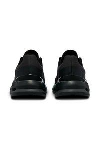 Black athletic shoes with a textured upper and a smooth, reflective heel. Cushioned sole with a rounded shape, designed for comfort.