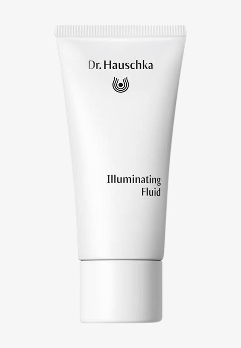 Dr. Hauschka white tube of Illuminating Fluid with black text and logo, plain background.