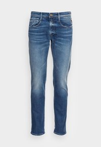 Blå denimjeans med rak passform, med knappgylft, framfickor och lätt blekning på låren.