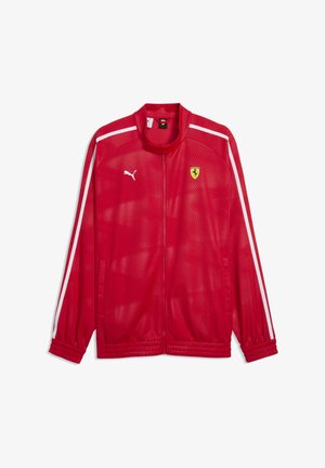 Veste rouge Puma zippée intégralement avec des bandes blanches sur les manches et le logo Ferrari sur la poitrine, dotée d'un col montant et de poignets élastiques.