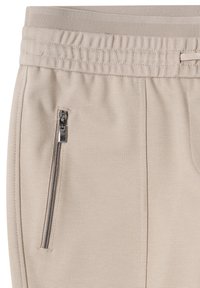 Lichtbeige joggers van een gestructureerde stof, voorzien van een elastische tailleband en een zijzak met ritssluiting voor veilige opberging.