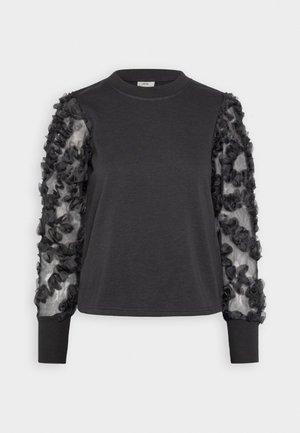 Black sweatshirt with textured mesh sleeves adorned with dark fabric flowers. features a round neck and fitted cuffs.
