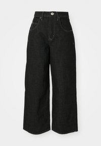 Wide-leg black denim jeans with a high waist, featuring front pockets, stitched seams, and a classic button closure. Soft, textured fabric.