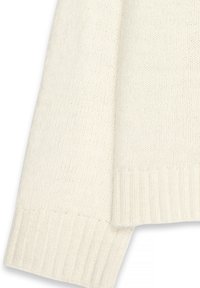 Kremno barvani pleteni pulover z rebrastim robom in manšetami, ki ima teksturirano tkanino in ohlapno prileganje.