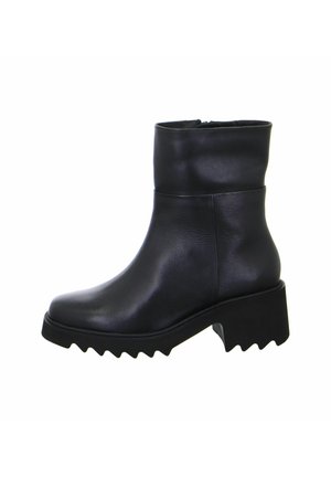 Black leather ankle boot with a rounded toe, chunky zigzag sole, and a smooth finish. Features a mid-height shaft and zip closure.