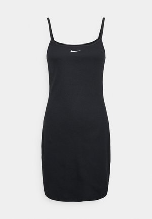 Schwarzes ärmelloses Bodycon-Kleid mit dünnen Trägern und kleinem weißen Nike-Logo mittig auf der Brust vor einfachem Hintergrund.