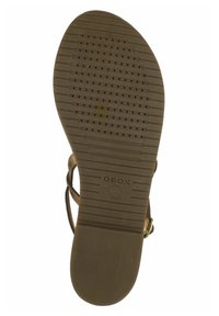 Suola in gomma marrone con grip testurizzato, dotata di perforazioni per la traspirabilità. Logo 'GEOX' stampato sul lato. Design piatto, senza tacco.