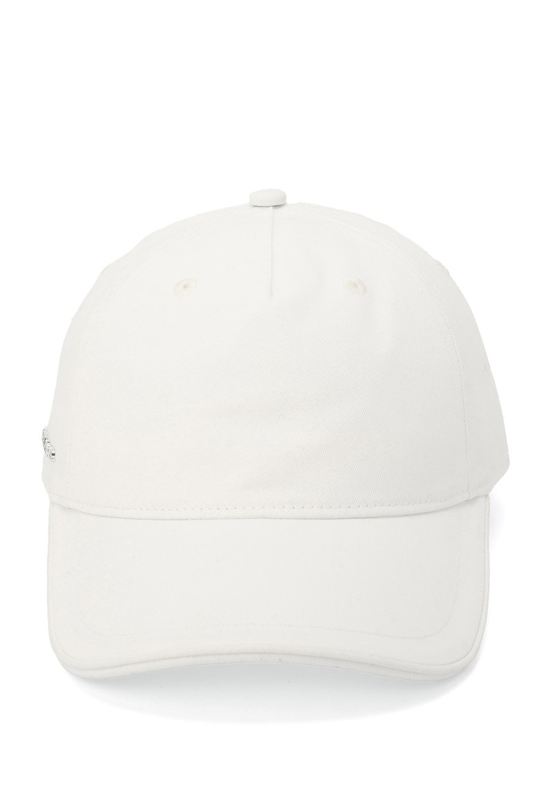 White cotton baseball cap with a curved brim, featuring ventilation holes and a small metal accent on the side. Smooth texture.
