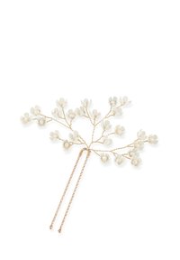 Accessorio per capelli con un design in metallo tono oro che ricorda dei rami, decorato con accenti floreali bianchi e due clip a pettine attaccate.