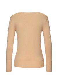 Helles pfirsichfarbenes, langärmliges Strickoberteil mit rundem Ausschnitt und taillierter Silhouette, das eine glatte Textur und ein minimales Design aufweist.