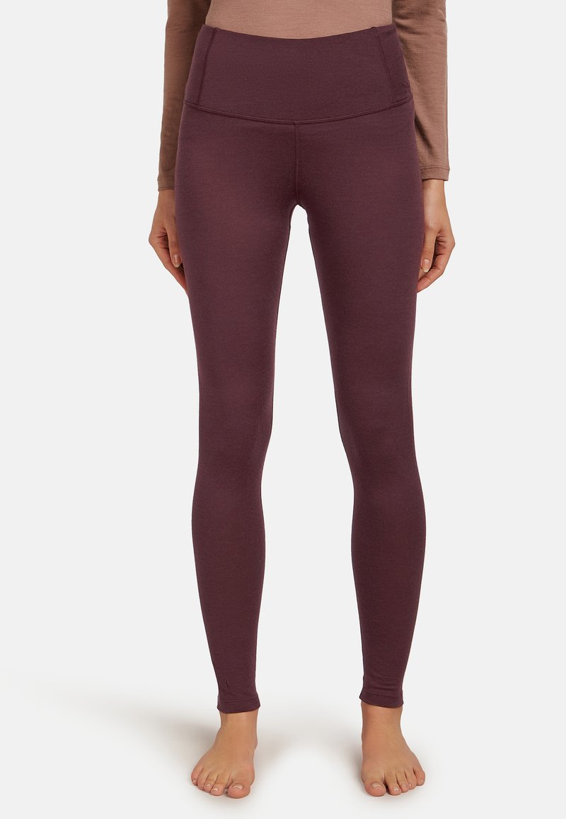 Burgunderrote Leggings mit hohem Bund, hergestellt aus einem weichen, dehnbaren Stoff. Das Design ist eng anliegend und reicht bis zu den Knöcheln, ohne Muster.