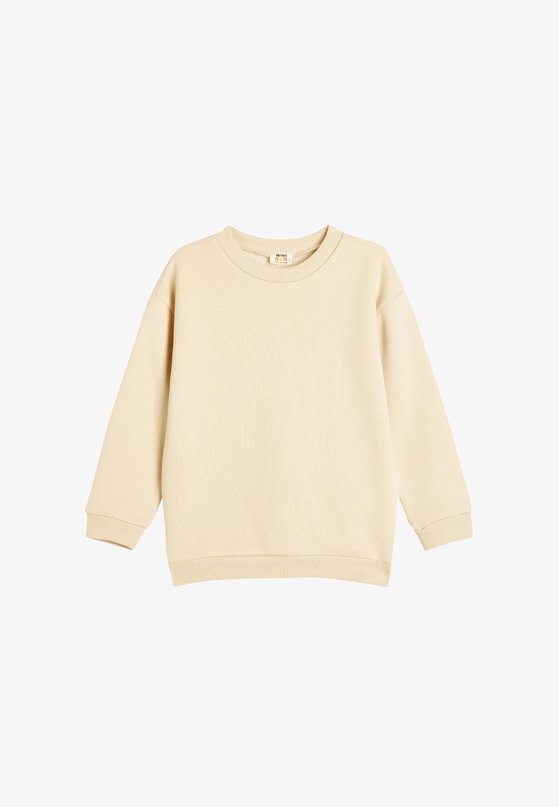 Beige trui met lange mouwen, geribbelde halslijn en manchetten, gemaakt van zacht materiaal. Beschikt over een eenvoudig, naadloos ontwerp zonder patronen.