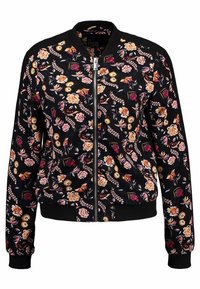 Bomberjakke i sort stof med farverige blomster mønstre. Har en frontlynlås, ribbede manchetter og kant. Letvægts og tætsiddende design.