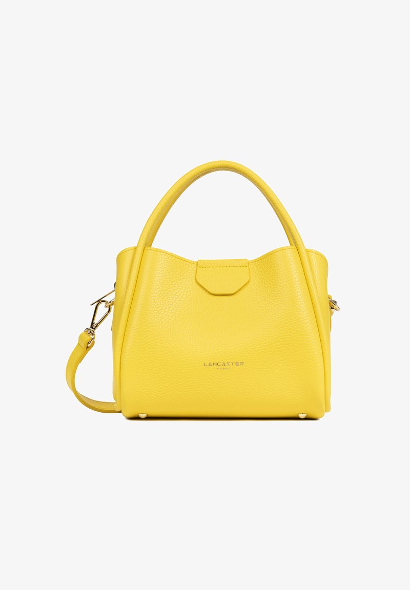 Sac à main en cuir jaune vif avec double poignée, bandoulière amovible et petit logo de marque argenté sur le devant.