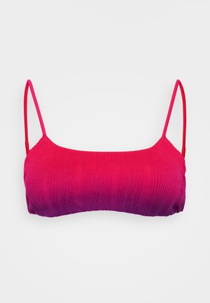 Bikiniöverdel med justerbara spaghettiband, med en övergång från rosa till lila, strukturerad ribbad design och sömlösa kanter.