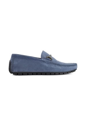 Blue suede men's loafer with black rubber sole and metal bit detail on top, shown in side profile on white background.