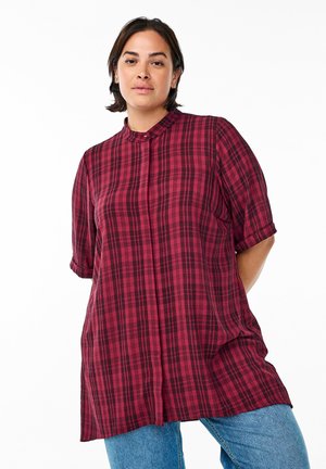 Red and black plaid shirt with a collar, short rolled sleeves, and a relaxed fit. Made of lightweight fabric, featuring a buttoned front.