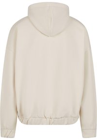 Cremefarvet hætte sweatshirt med snøret kant og manchetter, der har en glat tekstur og en afslappet pasform. Kun bagansigt.