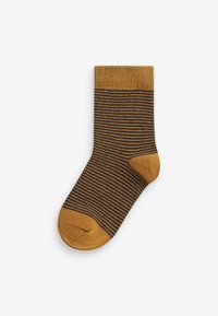 Gestreifte Socke in Senfgelb und Dunkelbraun. Gerippter Saum, nahtlose Spitze, mittlere Dicke und eine weiche, gestrickte Textur.