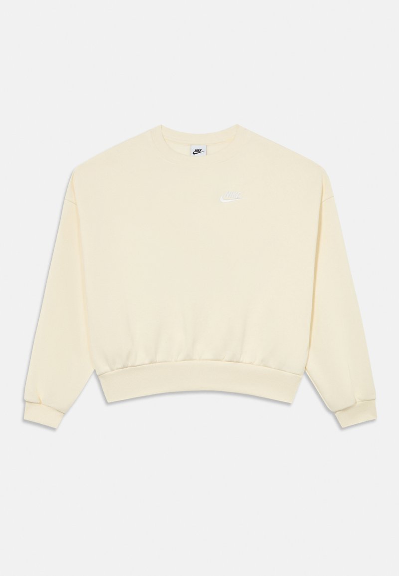 Világos sárga, rövidített pulóver puha anyagból. Kerek nyakkivágással, hosszú ujjakkal és a mellkason egy kis fehér Nike logóval.