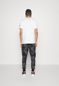 Puma Träningsbyxor - black