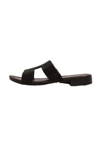 Sandalia negra deslizable con un diseño de tira de tela trenzada, punta abierta, suela plana y detalles mínimos. El zapato tiene una superficie texturizada.