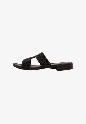 Black slide sandal with a woven fabric strap design, open toe, flat sole, and minimal detailing. The shoe has a textured surface.