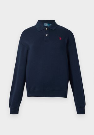 Navy blue long-sleeve polo shirt with two buttons, ribbed cuffs and hem, and small red embroidered logo on the left chest.