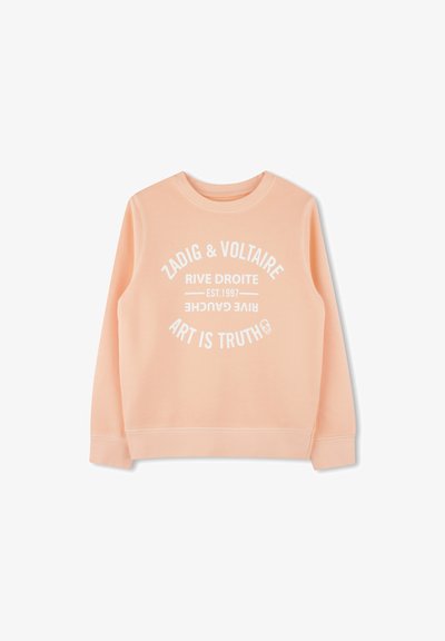 Un sweatshirt de couleur pêche en tissu doux, avec du texte imprimé blanc en design circulaire, et des poignets et un ourlet côtelés.