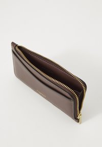 Brown leather wallet with gold zipper, featuring a smooth exterior, interior card slots, and a spacious compartment for coins or cash.